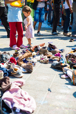 BUDAPEST, HUNGARY - SEPTEMBER 04: Refugees select donated shoes at the eastern Train Station Keleti...