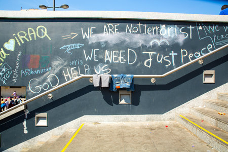BUDAPEST, HUNGARY - SEPTEMBER 04: Messages related to the Refugee situation written on a wall at the Train Station Keleti Palyudvar on September 04, 2015 in Budapest, Hungary.のeditorial素材