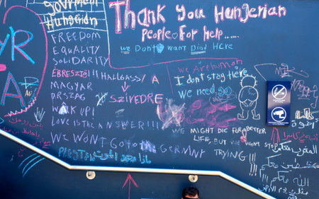 BUDAPEST, HUNGARY - SEPTEMBER 04: Messages related to the Refugee situation written on a wall at the Train Station Keleti Palyudvar on September 04, 2015 in Budapest, Hungary.のeditorial素材