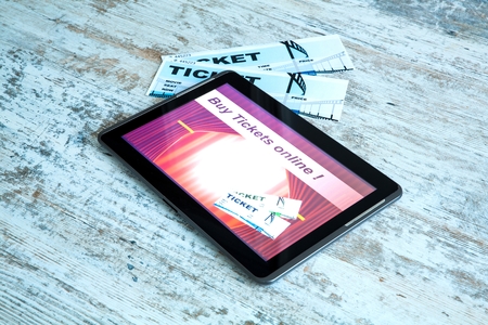 Buy Cinema Tickets online with a Tablet PCの写真素材