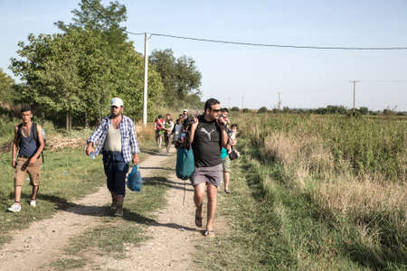 TOVARNIK, CROATIA - SEPTEMBER 18: Refugees cross the Serbian border to Croatia on September 18, 2015 in Tovarnik, Croatia.のeditorial素材