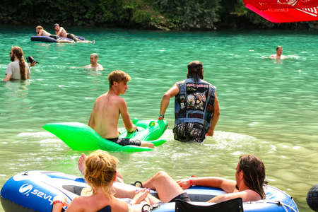 TOLMIN, SLOVENIA - July 21: Heavy Metal Fans have a party at and in the river Soca on the Metaldays Tolmin Festival on July 21, 2015 in Tolmin, Slovenia.のeditorial素材