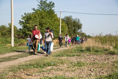 TOVARNIK, CROATIA - SEPTEMBER 18: Refugees cross the uncontrolled border from Serbia to Croatia on September 18, 2015 in Tovarnik, Croatia.のeditorial素材
