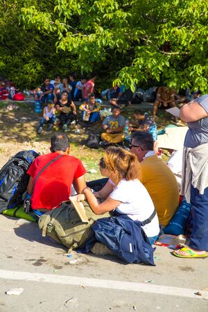 TOVARNIK, CROATIA - SEPTEMBER 18: Stranded Refugees gather in the Village after arrival from Serbia on September 18, 2015 in Tovarnik, Croatia.のeditorial素材