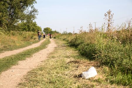 TOVARNIK, CROATIA - SEPTEMBER 18: Refugees cross the uncontrolled border from Serbia to Croatia on September 18, 2015 in Tovarnik, Croatia.のeditorial素材