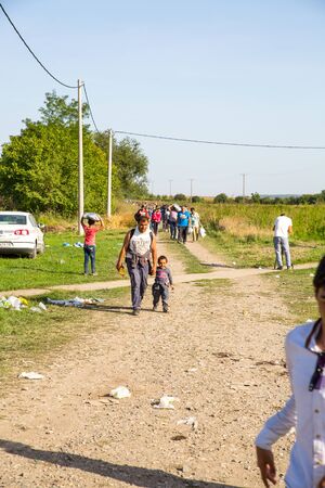 TOVARNIK, CROATIA - SEPTEMBER 18: Refugees cross the uncontrolled border from Serbia to Croatia on September 18, 2015 in Tovarnik, Croatia.のeditorial素材