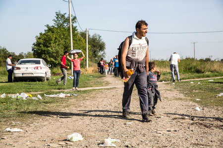 TOVARNIK, CROATIA - SEPTEMBER 18: Refugees cross the uncontrolled border from Serbia to Croatia on September 18, 2015 in Tovarnik, Croatia.のeditorial素材