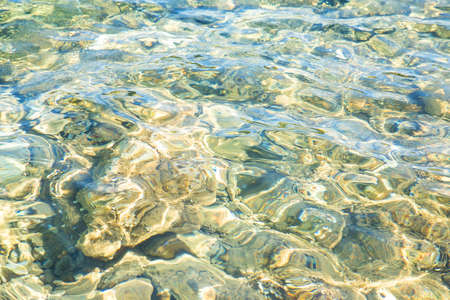 Background of transparent ocean water ripples.の写真素材