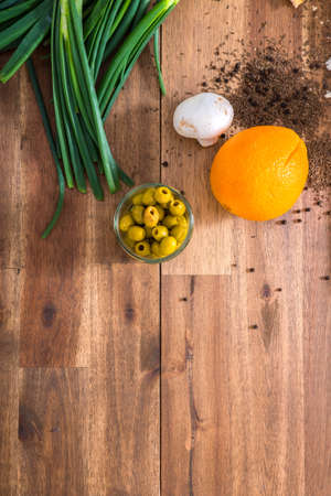Organic ingredients on a wooden Table in the Kitchen.の写真素材