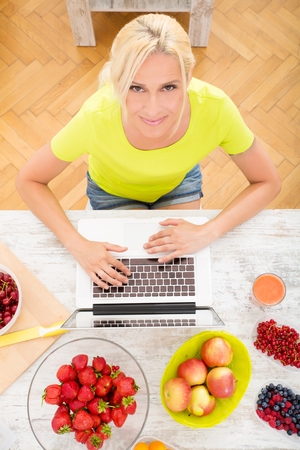 Mature woman enjoying a smoothieの写真素材