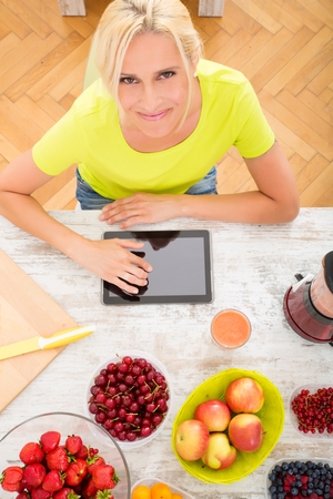 Mature woman enjoying a smoothieの写真素材