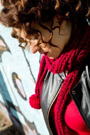Beautiful woman posing with graffitiの写真素材