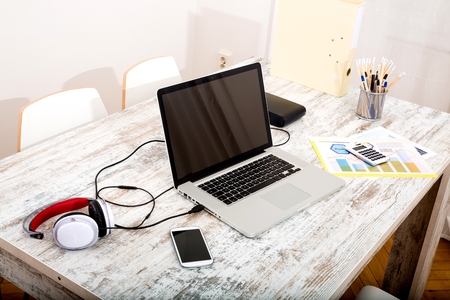 A modern home office setup on a wooden Table.&#xA;の写真素材