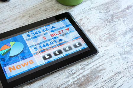 Stock market trading and research software on a Tablet PC on a office Desktop.