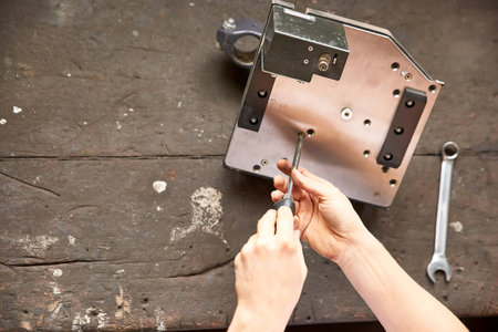A working woman hands using a screwdriver.の写真素材