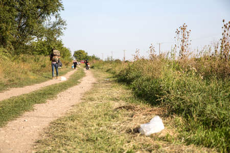 TOVARNIK, CROATIA - SEPTEMBER 18: Refugees cross the uncontrolled border from Serbia to Croatia on September 18, 2015 in Tovarnik, Croatia.のeditorial素材