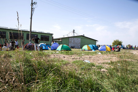 TOVARNIK, CROATIA - SEPTEMBER 19: Refugees camp at the border to Serbia on September 19, 2015 in Tovarnik, Croatia.のeditorial素材