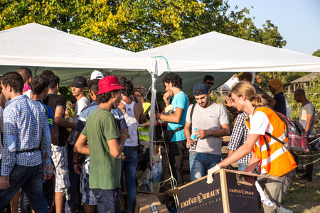 TOVARNIK, CROATIA - SEPTEMBER 18: Refugees access basic supplies by Volunteers on September 18, 2015...