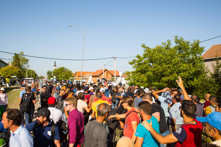 TOVARNIK, CROATIA - SEPTEMBER 18: Stranded Refugees gather in the Village after arrival from Serbia on September 18, 2015 in Tovarnik, Croatia.のeditorial素材