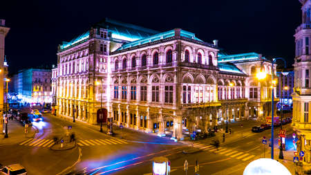 VIENNA, AUSTRIA - JANUARY 15, 2016: View on people and traffic pass by at the historic opera house...
