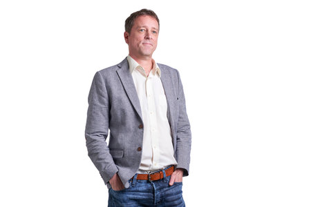 Portrait of a smiling middle age man in a shirt and a jacketの写真素材