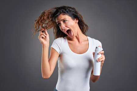 Young woman with a hairbrushの写真素材