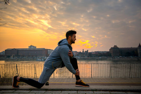 Young man stretchingの写真素材