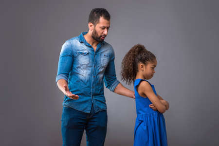 Young black father with his teenage daughterの写真素材