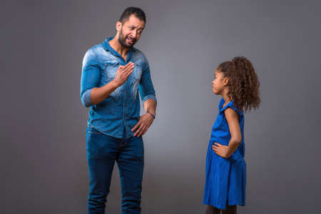 Young black father with his teenage daughterの写真素材