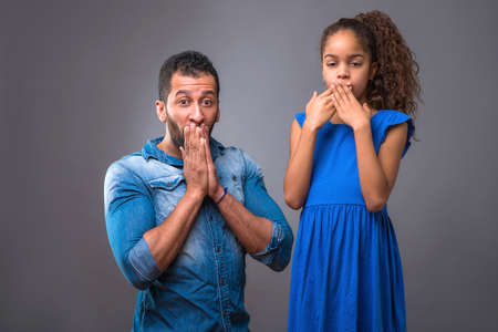 Young black father with his teenage daughterの写真素材