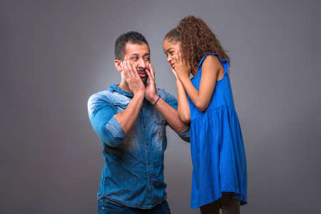 Young black father with his teenage daughterの写真素材