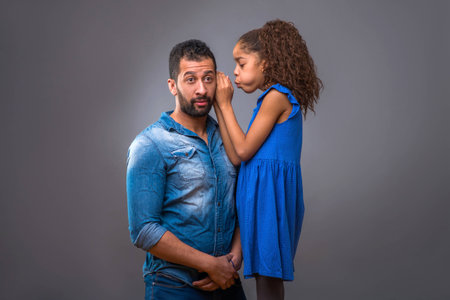 Young black father with his teenage daughterの写真素材