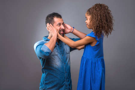 Young black father with his teenage daughterの写真素材