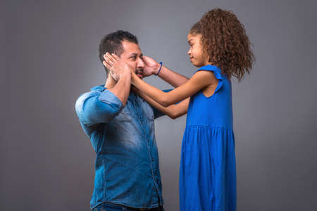 Young black father with his teenage daughterの写真素材