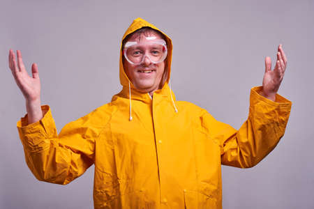 Man in yellow raincoatの写真素材