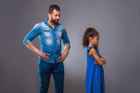 Young black father with his teenage daughterの写真素材