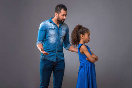 Young black father with his teenage daughterの写真素材