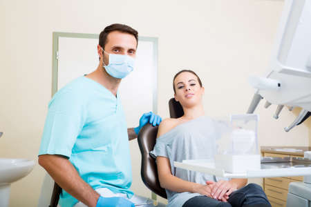 A young woman at her Dentists appointment.の写真素材