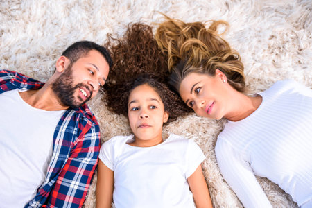 Young parents with their daughterの写真素材