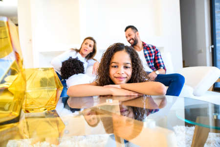 Teenage girl with her familyの写真素材