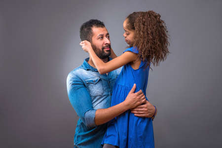 Young black father with his teenage daughter
