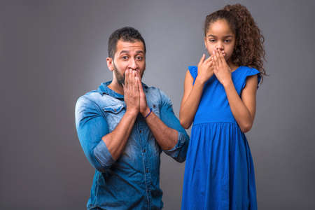 Young black father with his teenage daughterの写真素材