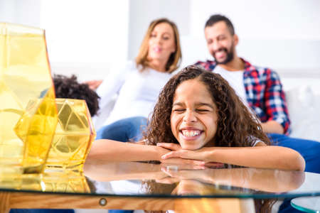 Teenage girl with her familyの写真素材