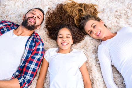 Young parents with their daughterの写真素材