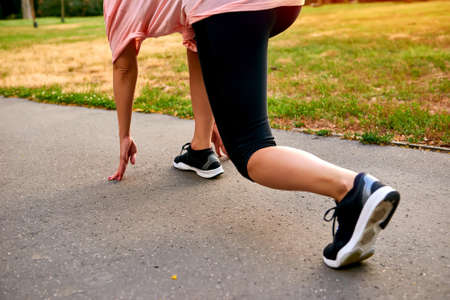 The legs from the back of a running woman