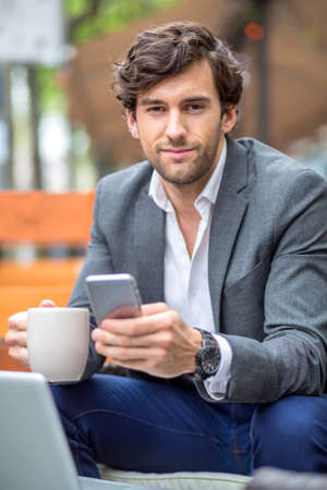 A handsome young man on the terraceの写真素材