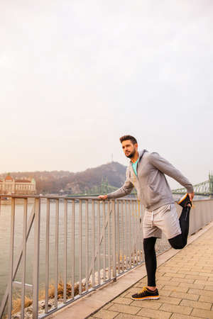 Young man stretchingの写真素材