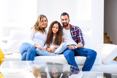 Young parents with their daughterの写真素材