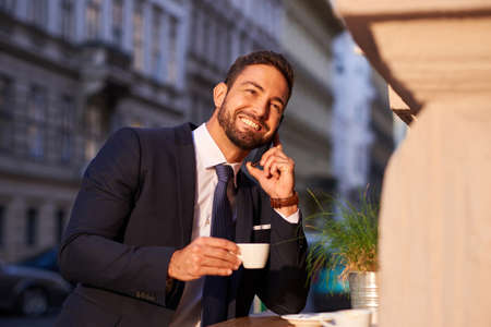 Young businessman drinking coffee