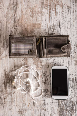 Wallet, smartphone and earphonesの写真素材
